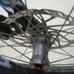 twice the spokes on brake side to reduce flex under load, opposite   side saves weight