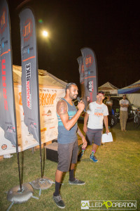 Dipen Desai, co-founder of HDX Hydration Mix, says "Thank You" to the racers watching the Awards Ceremony